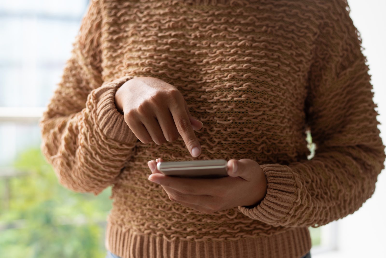 Reading a WhatsApp marketing message on a smartphone