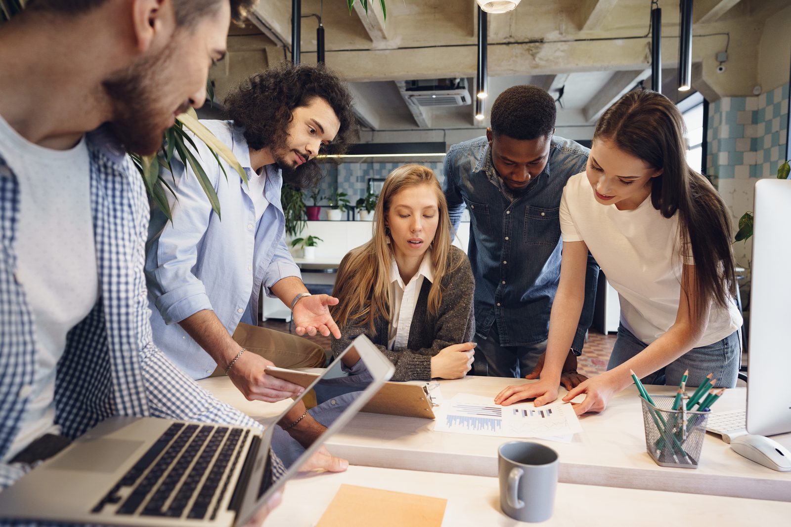 Team collaborating on a CRM migration in an office