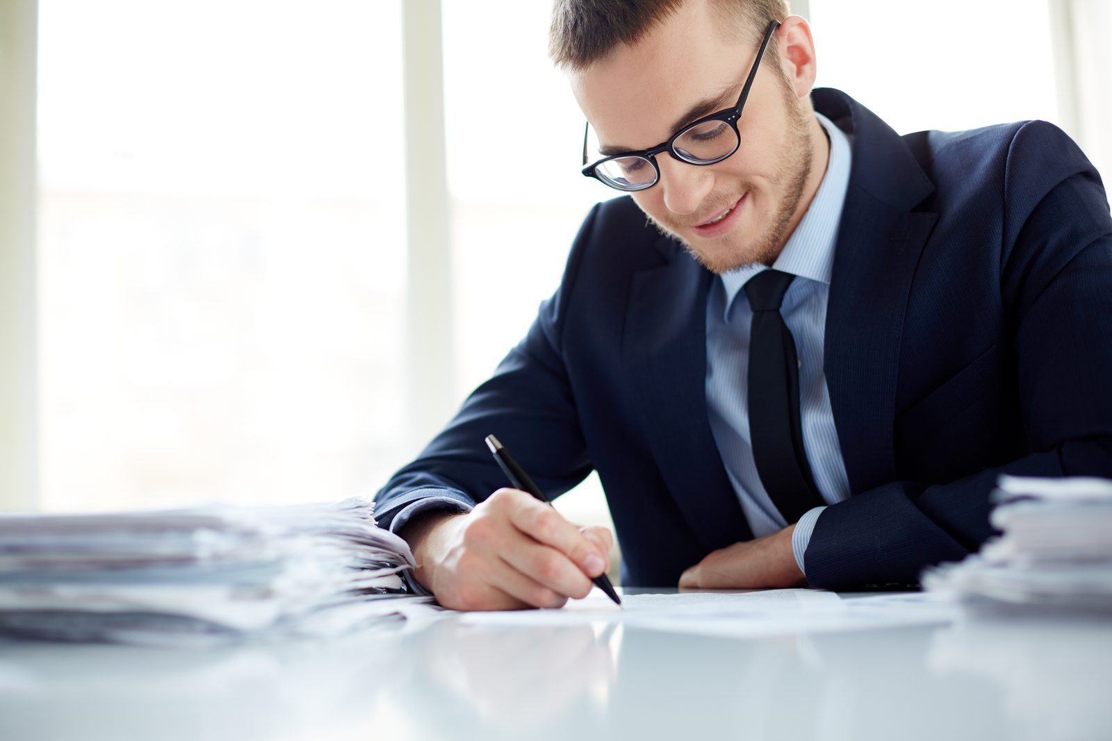 Advisor reviewing expert content at a desk