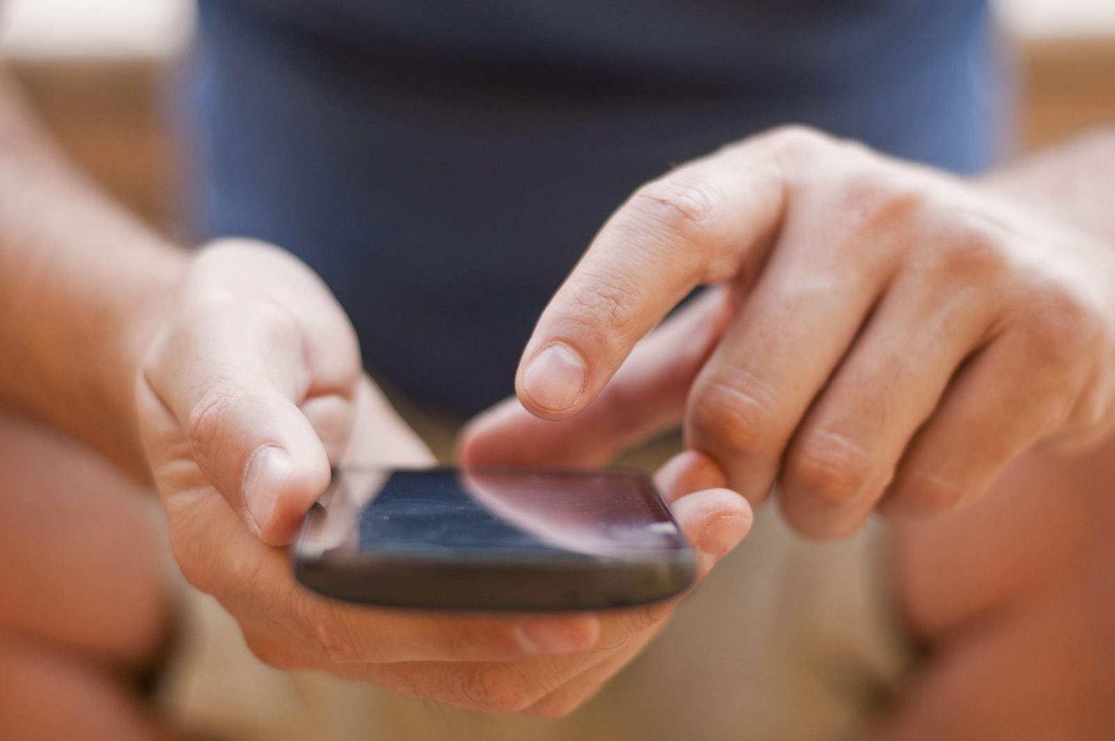 Event organiser sending a WhatsApp broadcast invitation from a phone